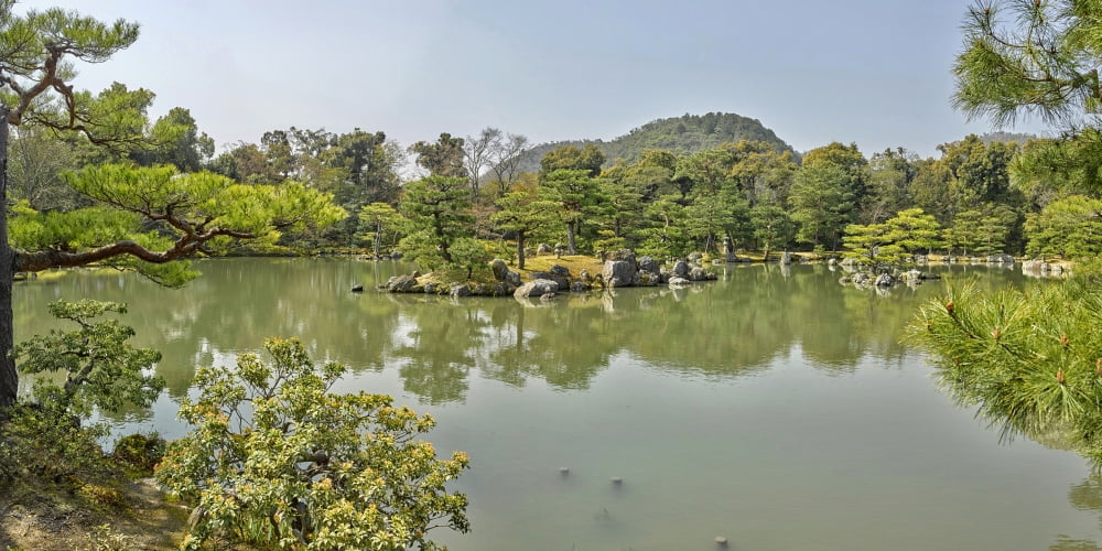 Reflection of trees on water Kinkaku-ji (Temple of the Golden Pavilion) Kyoto Kyoto Prefecture Japan Canvas Art - Panoramic Images (9 x 27)