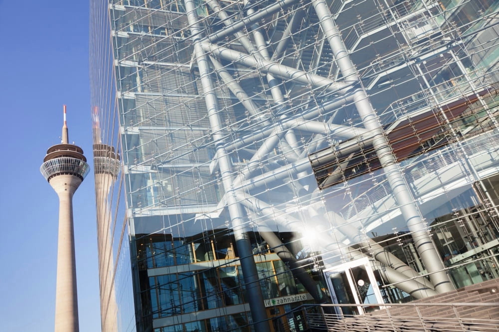 Reflection of a tower on a office building Rheinturm Tower Stadttor City Gate Dusseldorf North Rhine Westphalia Germany Canvas Art - Panoramic Images (27 x 9)