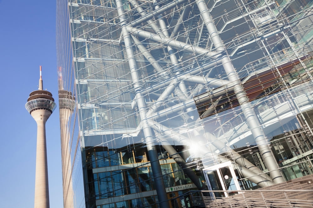 Reflection of a tower on a office building Rheinturm Tower Stadttor City Gate Dusseldorf North Rhine Westphalia Germany Canvas Art - Panoramic Images (36 x 12)