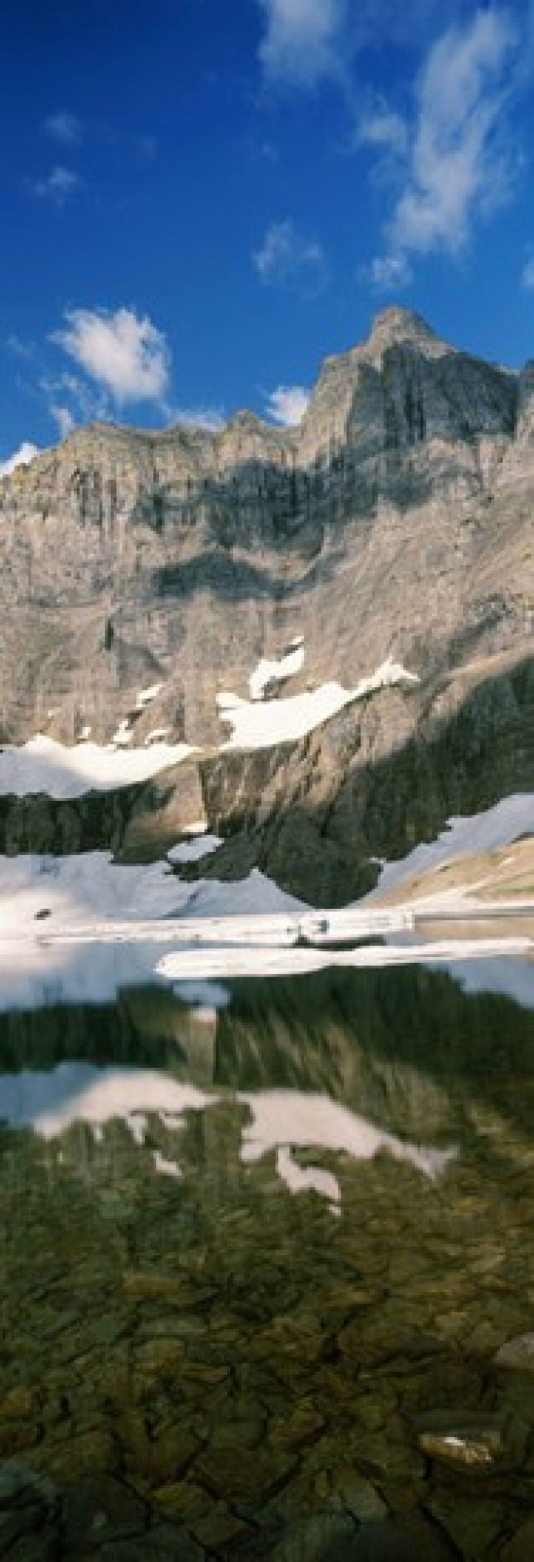 Reflections on lake at US Glacier National Park Montana USA Canvas Art - Panoramic Images (18 x 7)
