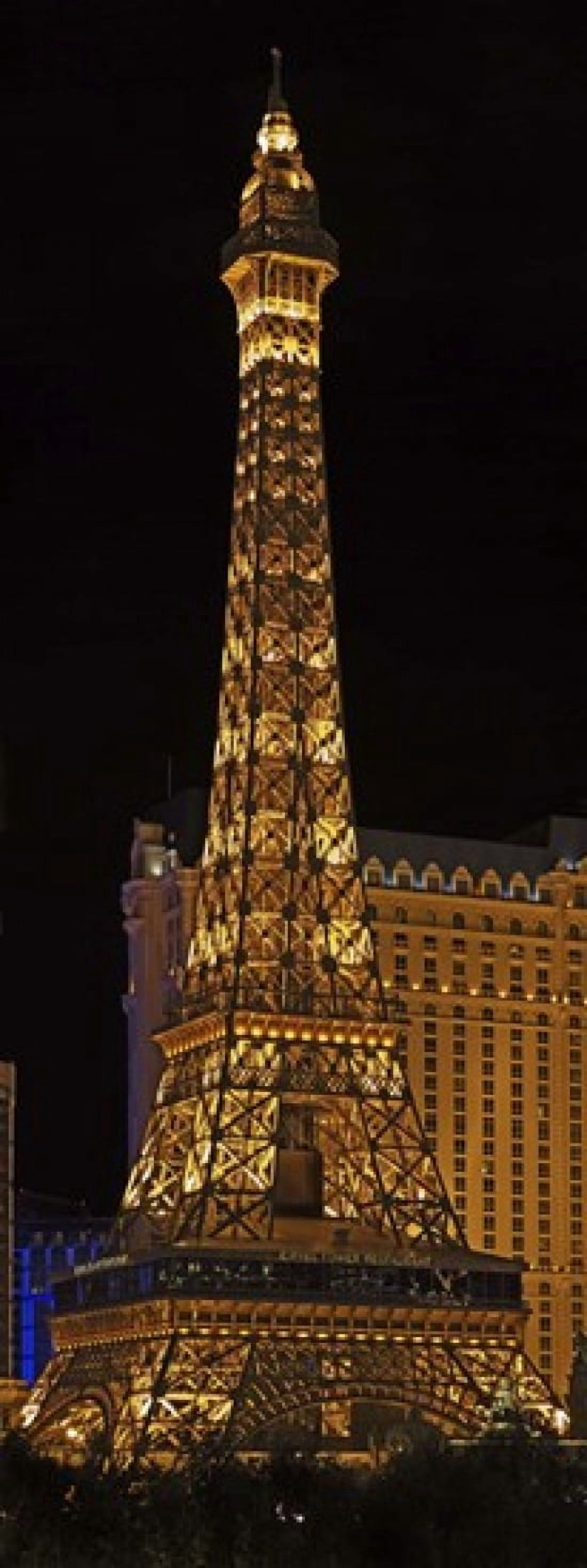 Replica of the Eiffel Tower lit up at night Paris Las Vegas Las Vegas Nevada USA Canvas Art - Panoramic Images (30 x 12)