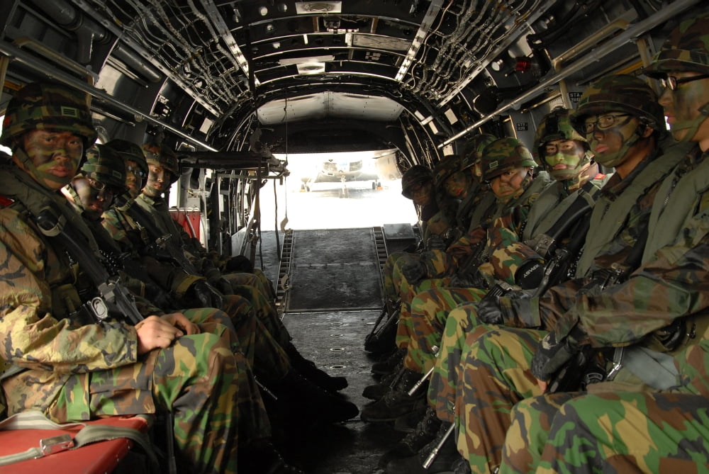 Republic of Korea Marines sit ready in a US Marine Corps CH-46E helicopter Canvas Art - Stocktrek Images (35 x 23)