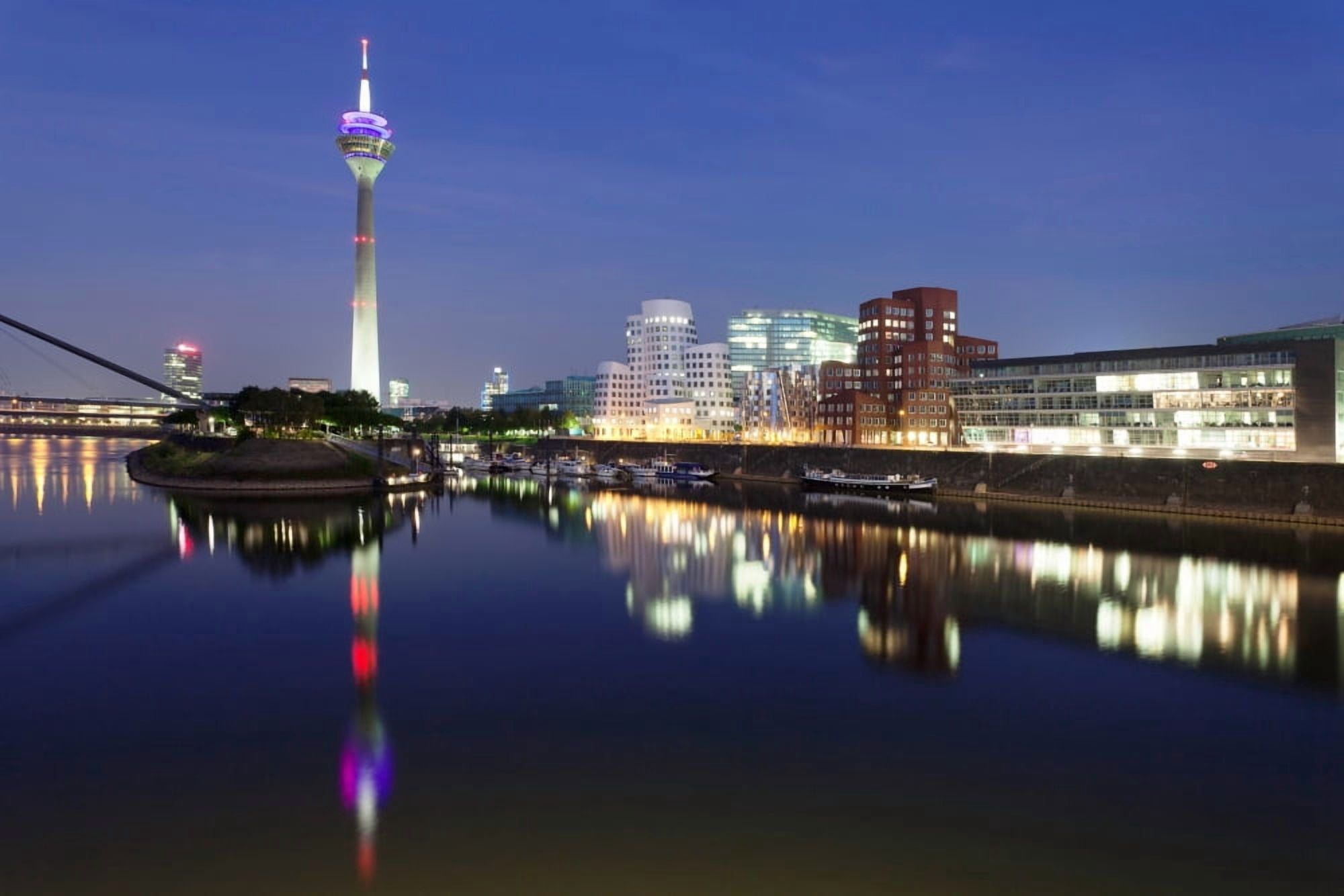 Rheinturm Tower and Gehry buildings at dusk Media Harbour Dusseldorf North Rhine Westphalia Germany Canvas Art - Panoramic Images (36 x 12)