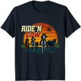 thumbnail image 1 of Ride'n Cow Black T-Shirt with Cowboy Horseback Riders at Sunset Design, 1 of 5