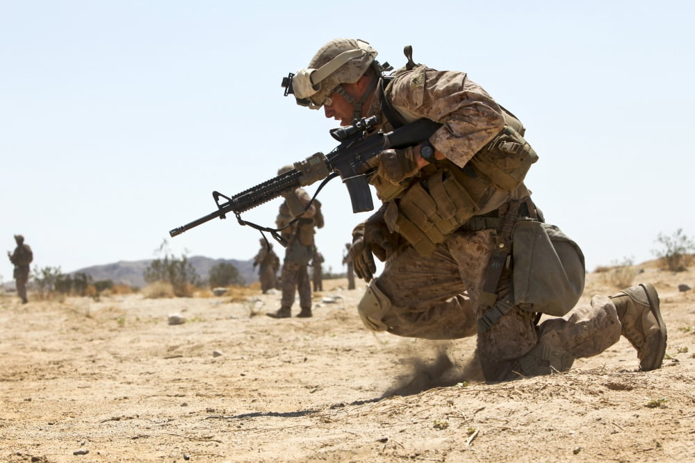 Rifleman kneels to the ground while conducting buddy rushes Canvas Art - Stocktrek Images (34 x 23)