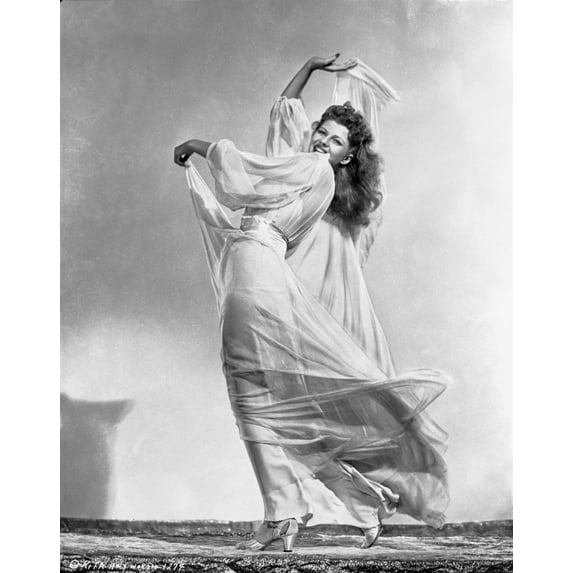 Rita Hayworth wearing a Gown with a Daring Pose Photo Print (8 x 10)
