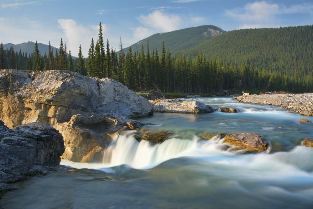 River and waterfall in morning light Bragg Creek Alberta Canada Canvas Art - Philippe Widling Design Pics (19 x 12)