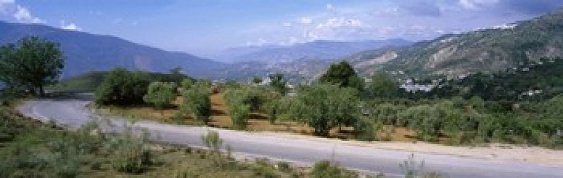 Road passing through a landscape with mountains in the background Andalucian Sierra Nevada Andalusia Spain Canvas Art - Panoramic Images (36 x 12)