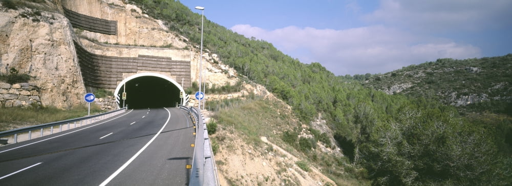 Road passing through a tunnel Sitges Barcelona Catalonia Spain Canvas Art - Panoramic Images (36 x 12)