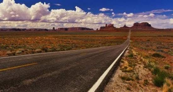 Road passing through a valley Monument Valley San Juan County Utah USA Canvas Art - Panoramic Images (24 x 14)
