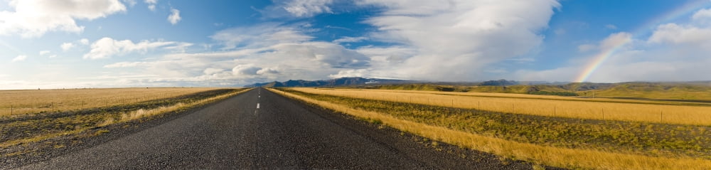 Road passing through landscape with rainbow Route 1 Iceland Canvas Art - Panoramic Images (36 x 12)