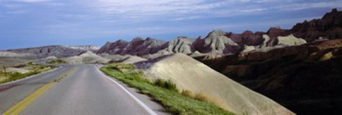 Road passing through the Badlands National Park South Dakota USA Canvas Art - Panoramic Images (18 x 6)