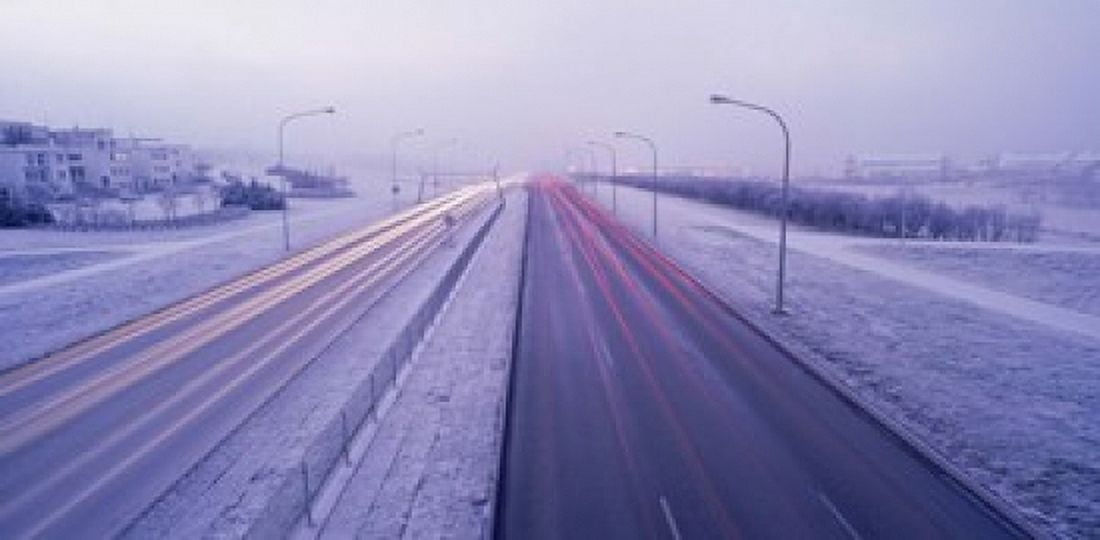Road running through a snow covered city Reykjavik Iceland Canvas Art - Panoramic Images (16 x 8)