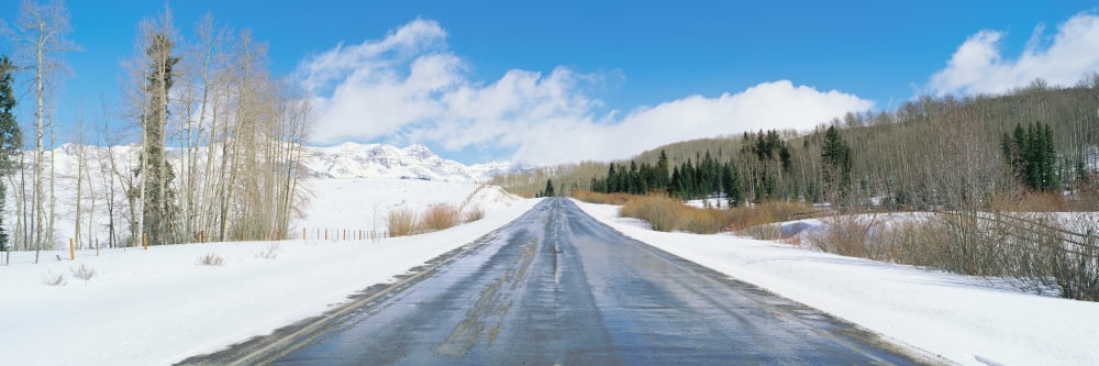 Road through snow covered countryside Colorado Canvas Art - Panoramic Images (36 x 12)
