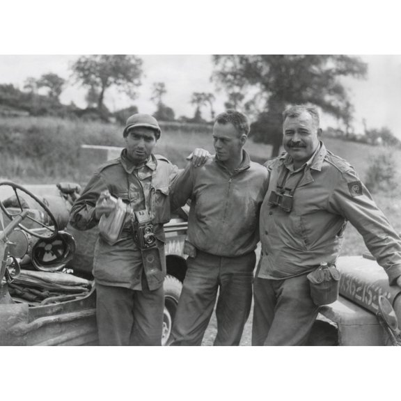 Robert Capa And Ernest Hemingway With Their Driver U.S. Army Driver. They Are Waiting To Follow An