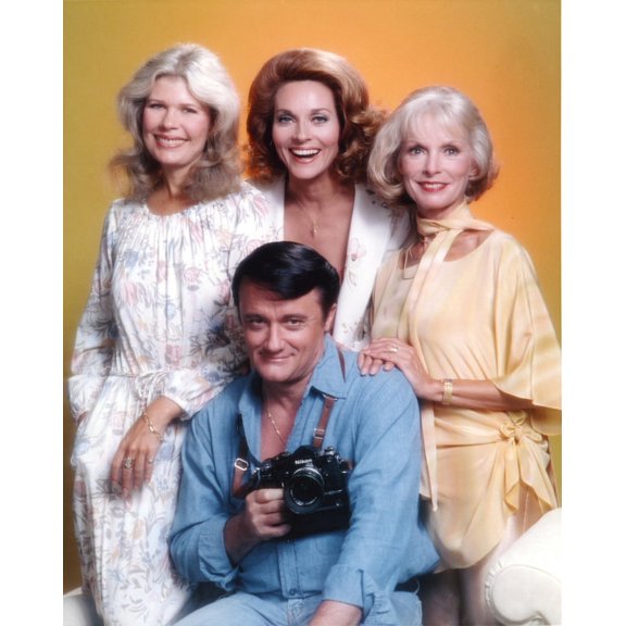 Robert Vaughn Holding a Camera in Yellow Background Photo Print (8 x 10)