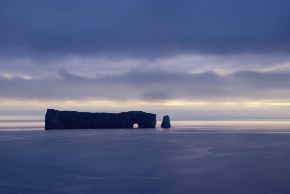Rock Formation Perce Rock In The Water In Shades Of Blue PerceQuebec Canada Canvas Art - Philippe Widling Design Pics (38 x 24)
