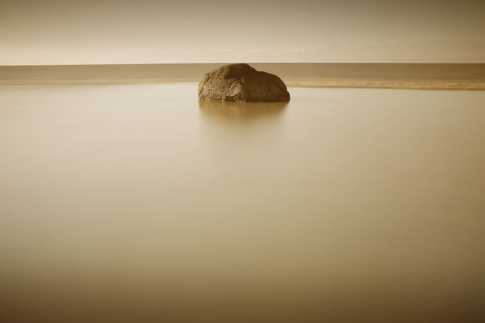 Rock In Still Water Grand Beach Manitoba Canvas Art - Mirek Weischel Design Pics (34 x 22)