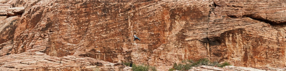 Rock climber climbing a rock Red Rock Canyon National Conservation Area Nevada USA Canvas Art - Panoramic Images (36 x 9)