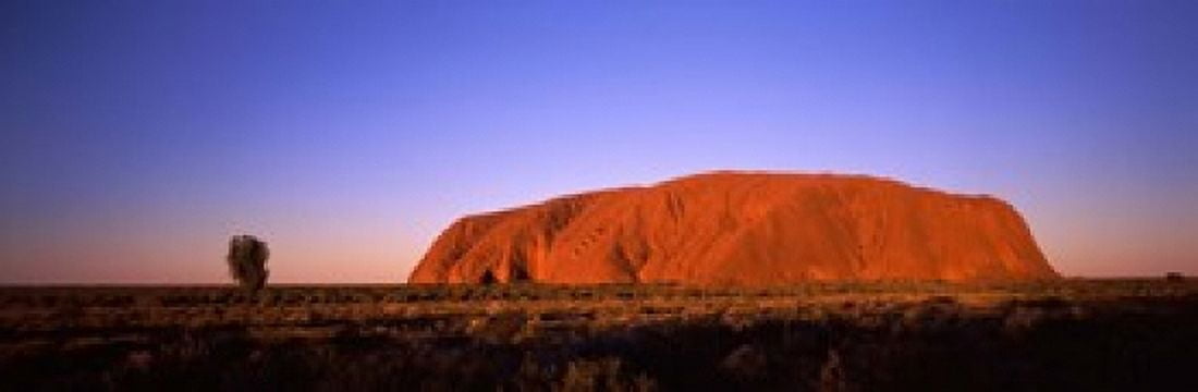 Rock formation Uluru Uluru-Kata Tjuta National Park Northern Territory Australia Canvas Art - Panoramic Images (18 x 6)