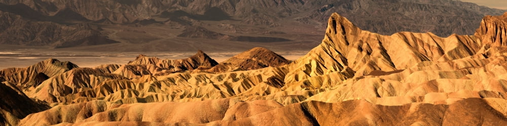 Rock formation on a landscape Zabriskie Point Death Valley Death Valley National Park California USA Canvas Art - Panoramic Images (36 x 9)