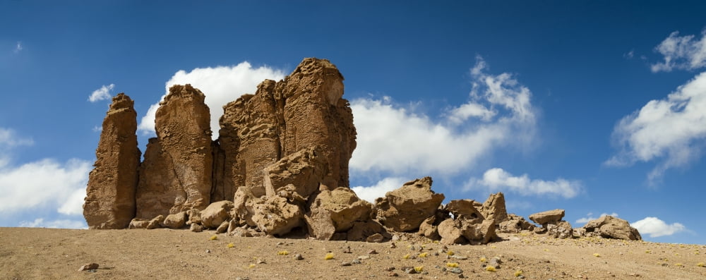 Rock formations in the Pacana Guardians in Los Flamencos National Reserve near San Pedro de Atacama Antofagasta Region Chile Canvas Art - Panoramic Images (27 x 9)