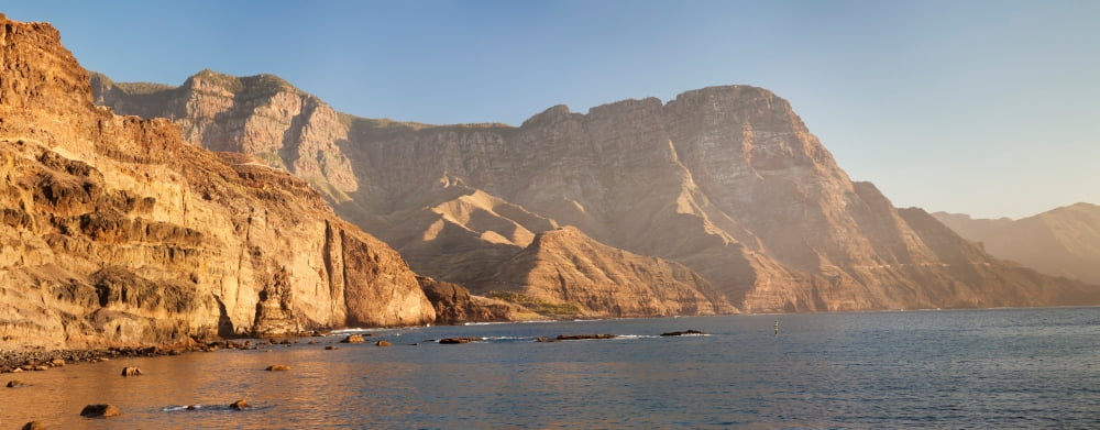 Rock formations at coast El Dedo de Dios Puerto de las Nieves Gran Canaria Spain Canvas Art - Panoramic Images (36 x 12)