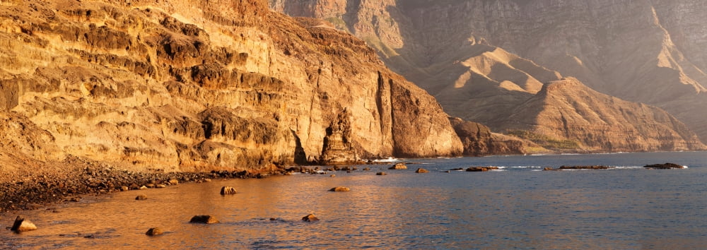 Rock formations at coast El Dedo de Dios Puerto de las Nieves Gran Canaria Spain Canvas Art - Panoramic Images (36 x 12)
