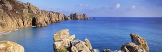 Rock formations at seaside Logan rock Porthcurno Bay Cornwall England Canvas Art - Panoramic Images (36 x 12)