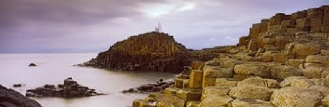 Rock formations at the coast Giants Causeway Bushmills County Antrim Northern Ireland Canvas Art - Panoramic Images (18 x 6)