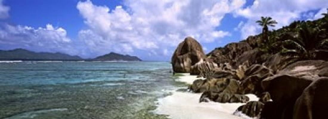 Rock formations on the beach on Anse Source dArgent beach with Praslin Island in the background La Digue Island Seychelles Canvas Art - Panoramic Images (18 x 7)