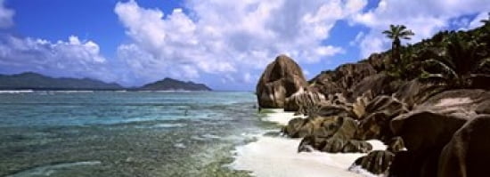 Rock formations on the beach on Anse Source dArgent beach with Praslin Island in the background La Digue Island Seychelles Canvas Art - Panoramic Images (36 x 13)