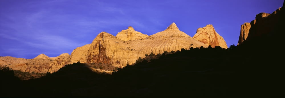 Rock formations in Capitol Reef National Park against blue sky Utah USA Canvas Art - Panoramic Images (36 x 12)