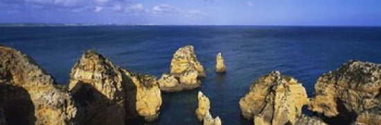 Rock formations in the sea Algarve Lagos Portugal Canvas Art - Panoramic Images (36 x 12)