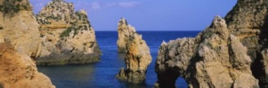 Rock formations in the sea Algarve Lagos Portugal Canvas Art - Panoramic Images (36 x 12)