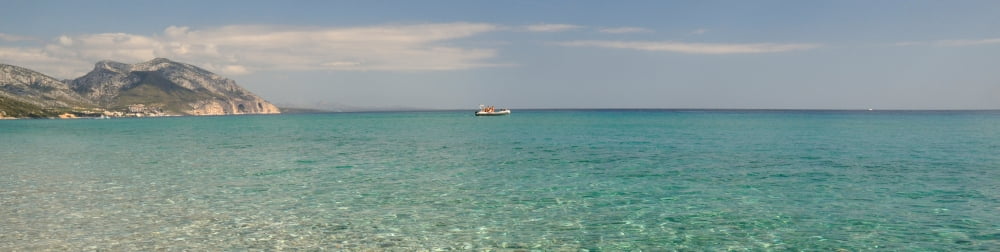 Rock formations in the sea Cala Luna Cala Gonone Nuoro Sardinia Italy Canvas Art - Panoramic Images (36 x 12)