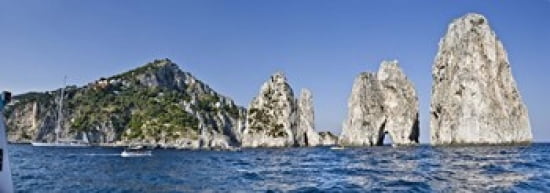 Rock formations in the sea Faraglioni Capri Naples Campania Italy Canvas Art - Panoramic Images (36 x 13)