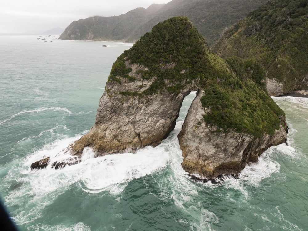 Rock formations in the sea Milford Sound South Island New Zealand Canvas Art - Panoramic Images (18 x 24)