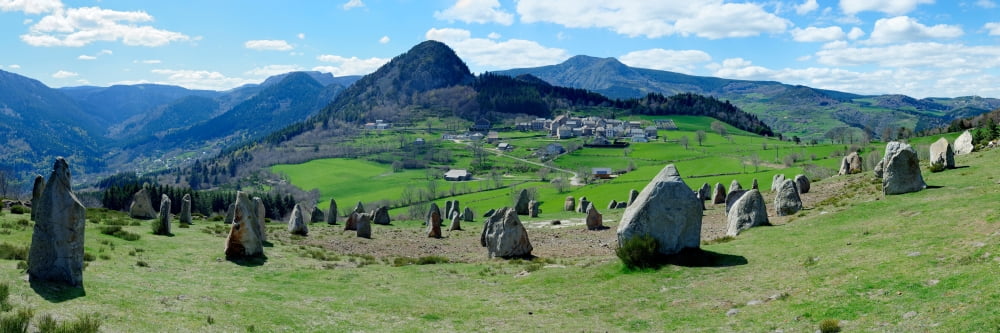 Rock formations on landscape with mountain range in the background Boree Ardeche Rhone-Alpes Massif Central France Canvas Art - Panoramic Images (12 x 36)