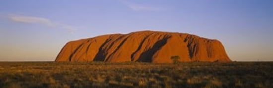 Rock formations on a landscape Ayers Rock Uluru-Kata Tjuta National Park Northern Territory Australia Canvas Art - Panoramic Images (18 x 6)