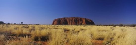 Rock formations on a landscape Ayers Rock Uluru-Kata Tjuta National Park Northern Territory Australia Canvas Art - Panoramic Images (36 x 12)