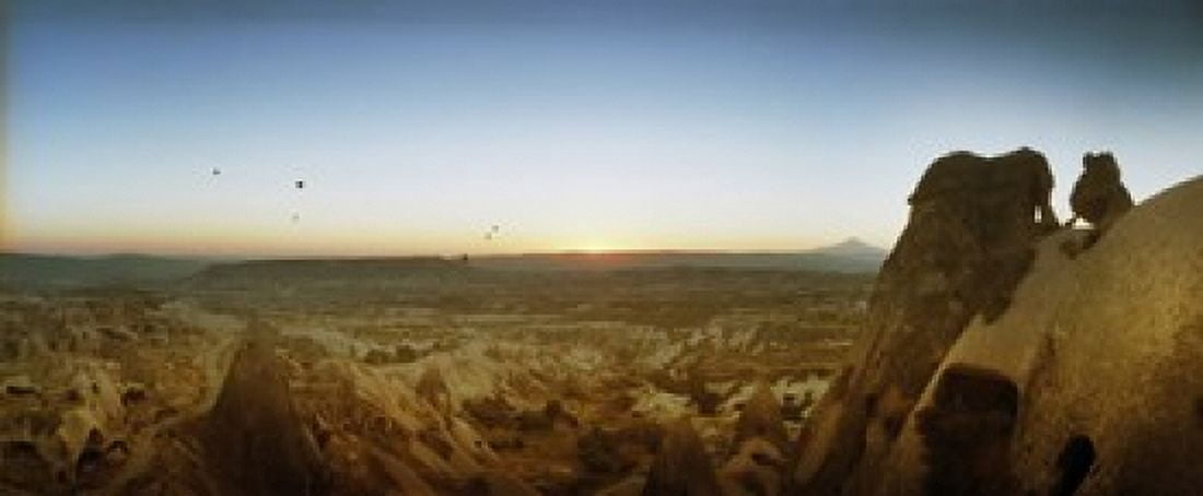 Rock formations on a landscape at sunrise Cappadocia Central Anatolia Region Turkey Canvas Art - Panoramic Images (30 x 13)