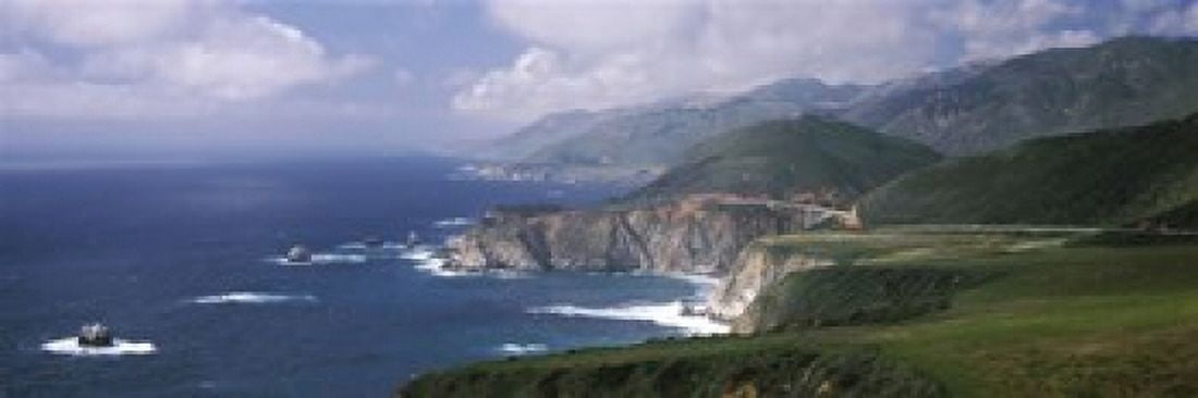 Rock formations on the beach Bixby Bridge Pacific Coast Highway Big Sur California USA Canvas Art - Panoramic Images (60 x 20)
