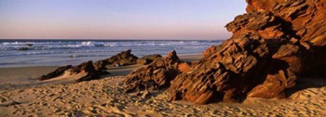 Rock formations on the beach Carrapateira Beach Algarve Portugal Canvas Art - Panoramic Images (18 x 7)