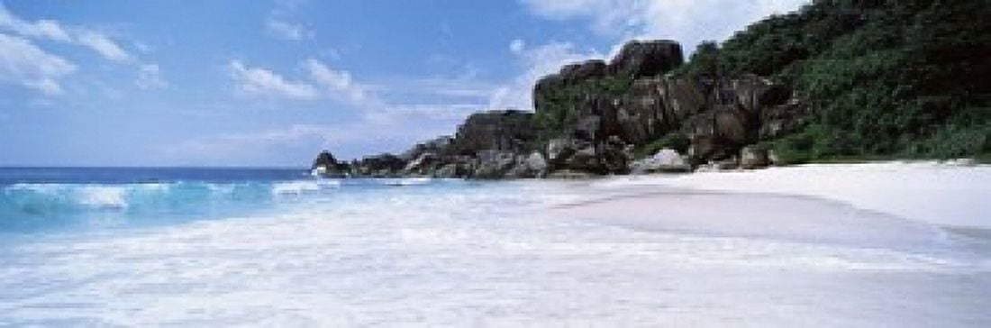 Rock formations on the beach Grand Anse La Digue Island Seychelles Canvas Art - Panoramic Images (18 x 6)