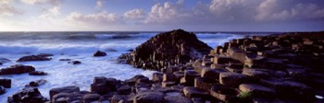 Rock formations on the coast Giants Causeway County Antrim Northern Ireland Canvas Art - Panoramic Images (18 x 6)