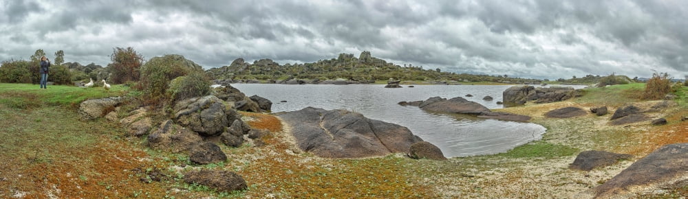 Rock formations at riverbank Los Barruecos Natural Park Malpartida de Caceres Caceres Caceres Province Extremadura Spain Canvas Art - Panoramic Images (6 x 20)