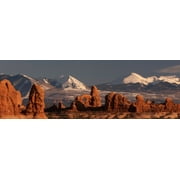 Rock formations with snow covered mountain range in the background, Turret Arch, La Sal Mountains, Arches National Park, Utah, USA Poster Print (12 x 36)