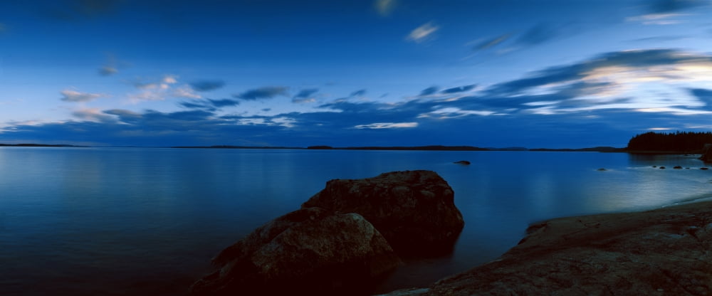 Rocks in the lake Lake Pielinen Lieksa North Karelia Eastern Finland Finland Canvas Art - Panoramic Images (36 x 12)
