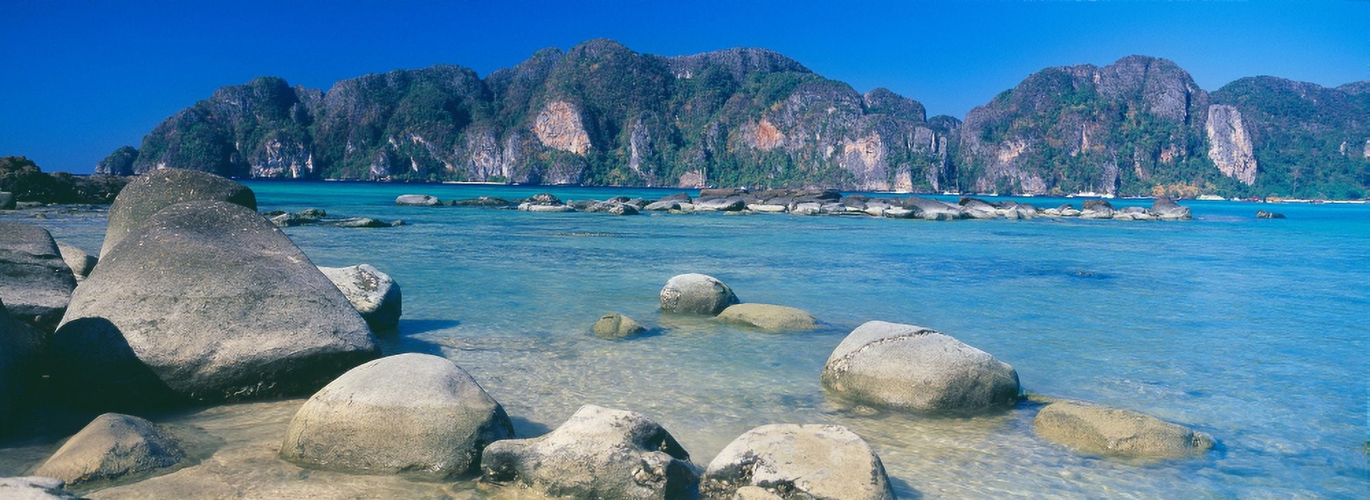 Rocks on the coast Phi Phi Islands Phuket Province Thailand Canvas Art - Panoramic Images (27 x 9)